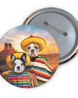 Custom pin with two cartoon dogs in sombreros and ponchos against a desert sunset.