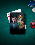 Personalized playing cards featuring two custom pet portraits in royal and hip-hop styles, on a green poker table.