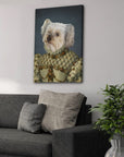 Personalized Princess Pet Canvas featuring a white dog in a regal, ornate gown, hanging above a gray sofa.