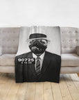 Personalized pet blanket with a black and white pug in a fedora and suit, styled as a mugshot.