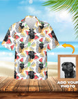 Custom Hawaiian shirt with black pug pet portraits, pineapples, watermelons, and lemons on white fabric.