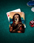 Personalized playing cards featuring a dog's portrait in a renaissance Mona Lisa style on a green felt table.