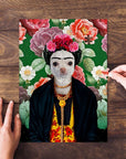 Personalized Frida Doggo pet puzzle featuring a chihuahua in a floral background, with hands assembling it.