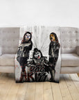 Personalized 3-pet blanket with dogs in Kiss rock band costumes, white background, on a gray sofa.