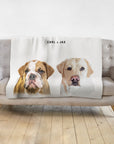 Personalized modern pet blanket with custom watercolor portraits of a bulldog and a labrador, named Carl & Jax.