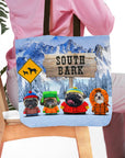 Personalized 'South Bark' tote bag with four custom pet portraits in winter outfits against a snowy mountain backdrop.