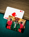 Custom personalized playing cards featuring five pets in Squid Game costumes on a green felt table.