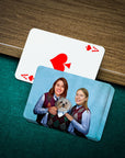 Personalized playing cards featuring a custom portrait of two women and a dog on a blue card.