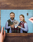 Personalized puzzle featuring a man, woman, and dog in matching argyle sweaters, with hands assembling it.