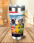 Personalized stainless steel tumbler with custom cartoon dog portraits on a beach.