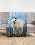 Personalized pet blanket with a Doggovinci portrait of a bulldog-goat hybrid on a mountain.