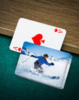 Personalized pet playing cards with a custom 'Skier' portrait design on a green felt table.