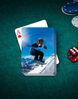 Personalized pet playing cards featuring a dog in a snowboarder portrait on a green felt table with dice and chips.
