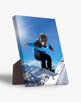 Personalized pet standing canvas featuring a pug's head on a snowboarder in a blue jacket, mid-air over snowy mountains.