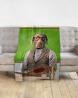Personalized pet blanket featuring a chocolate lab dog in a teacher portrait style, draped over a gray sofa.