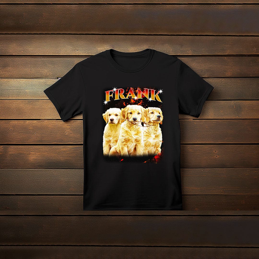 Black custom t-shirt with "FRANK" in fiery orange text above three golden retriever puppies.