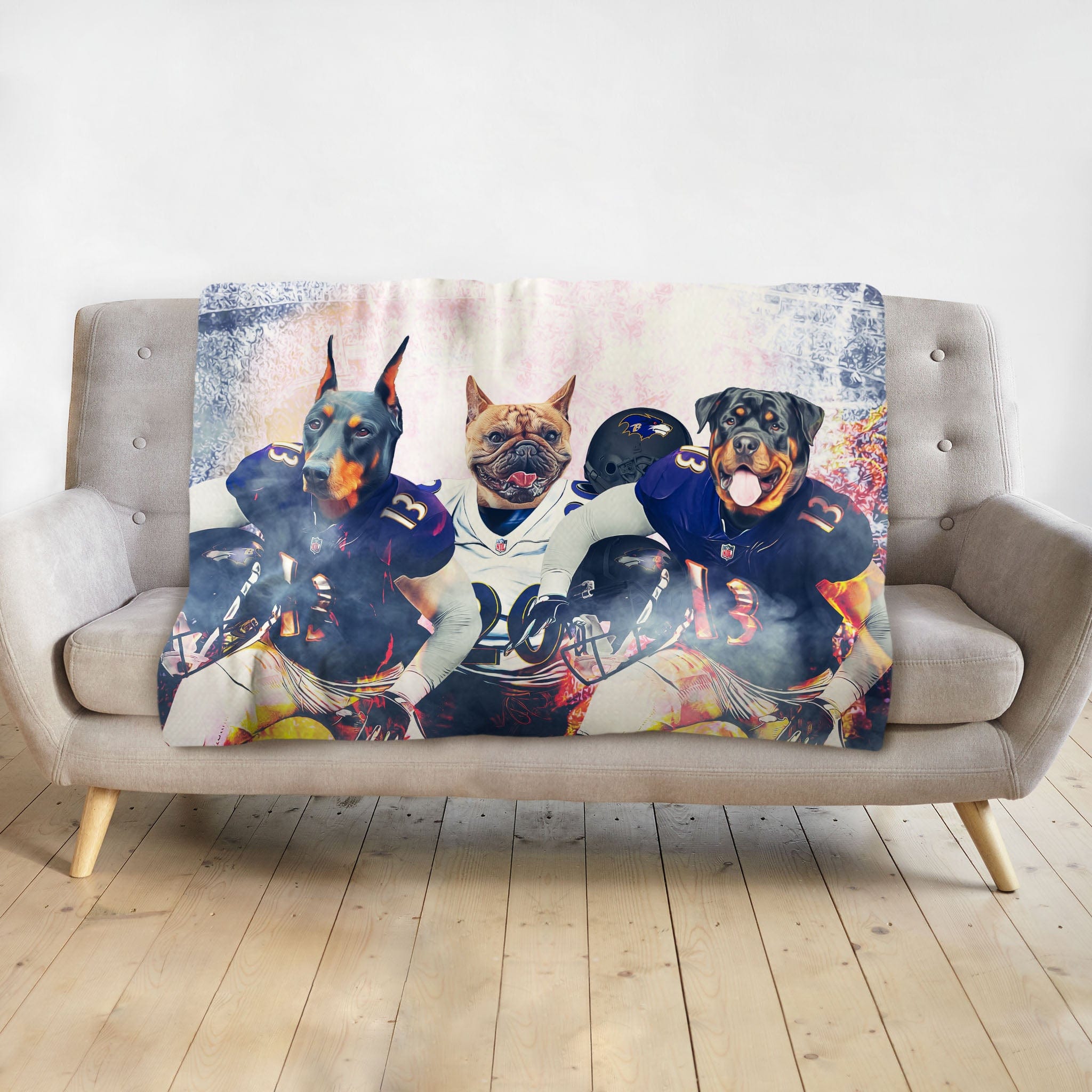 Personalized blanket with three dogs as football players in Baltimore Ravens uniforms.
