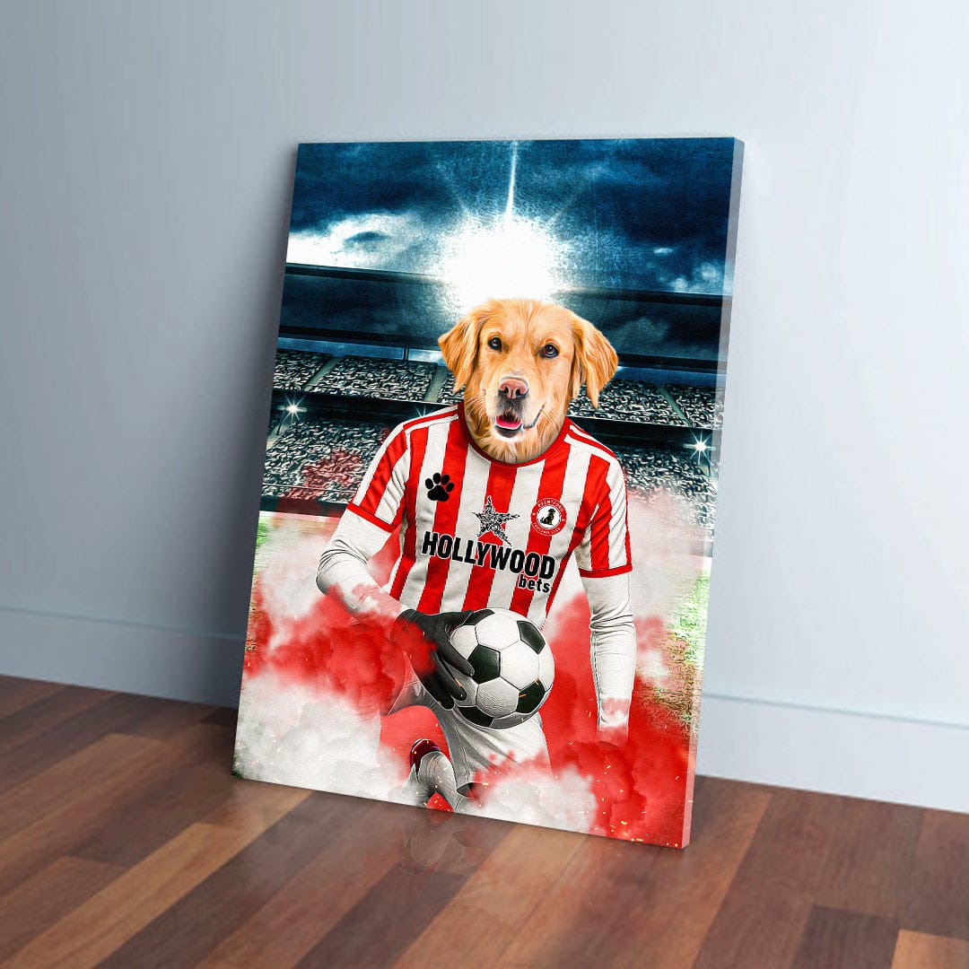 Golden Retriever in a red and white striped Brentford football kit holding a soccer ball on a canvas.