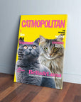 Yellow "Catmopolitan" canvas with two cats, a grey and a tabby, on a wooden floor.