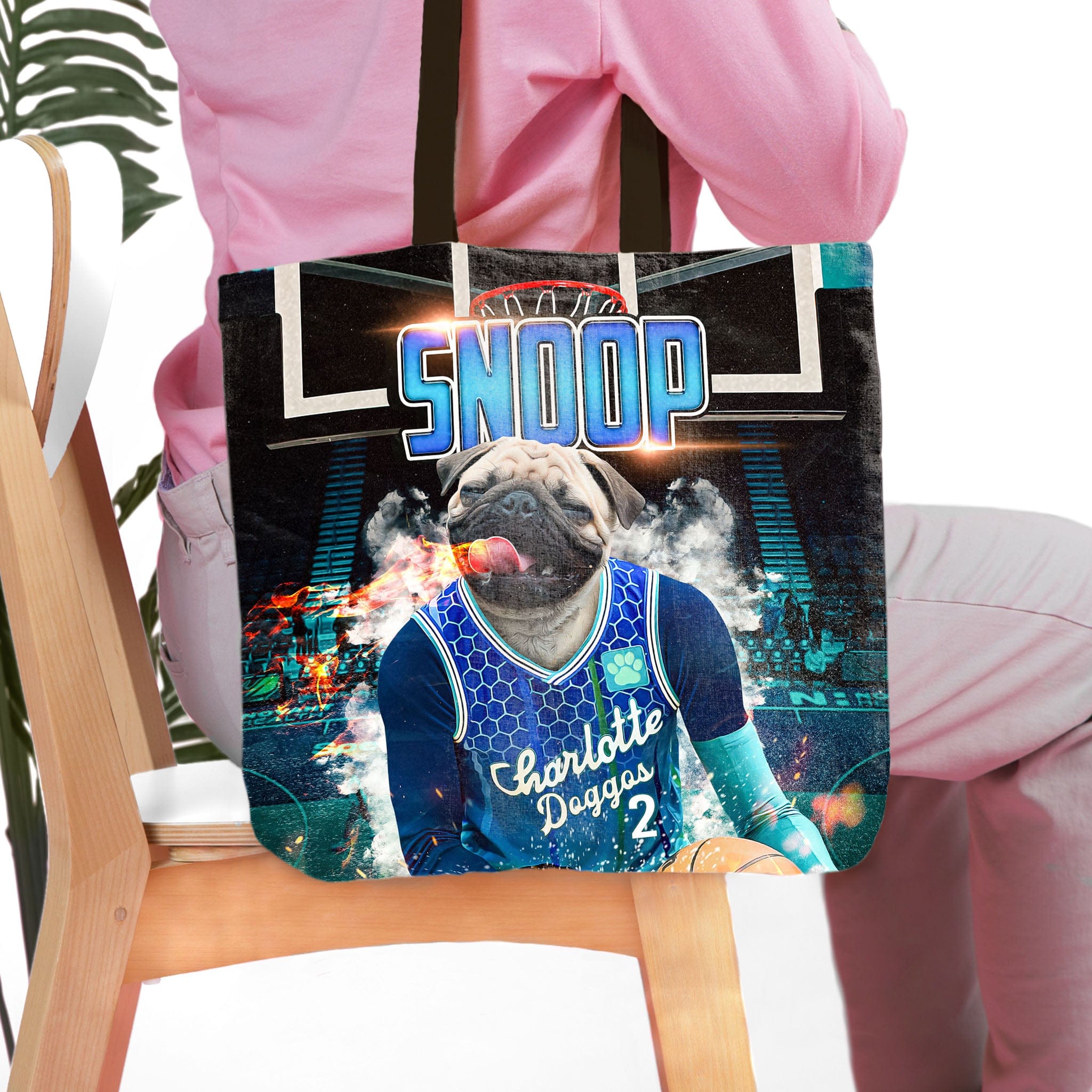 Personalized black tote bag with a pug pet portrait in a Charlotte Doggos basketball jersey.