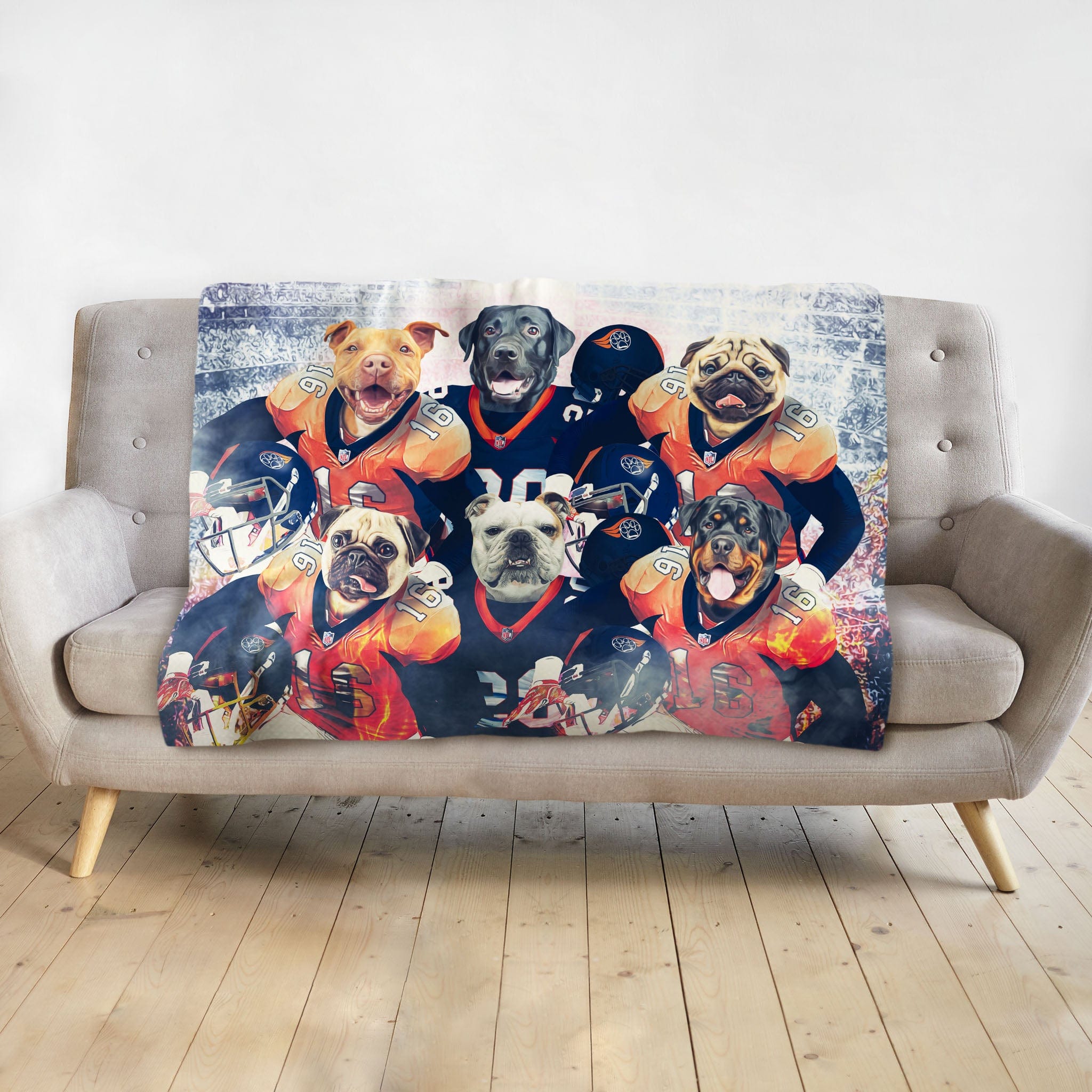 Personalized 6-pet blanket featuring dogs in football uniforms, draped on a grey sofa.