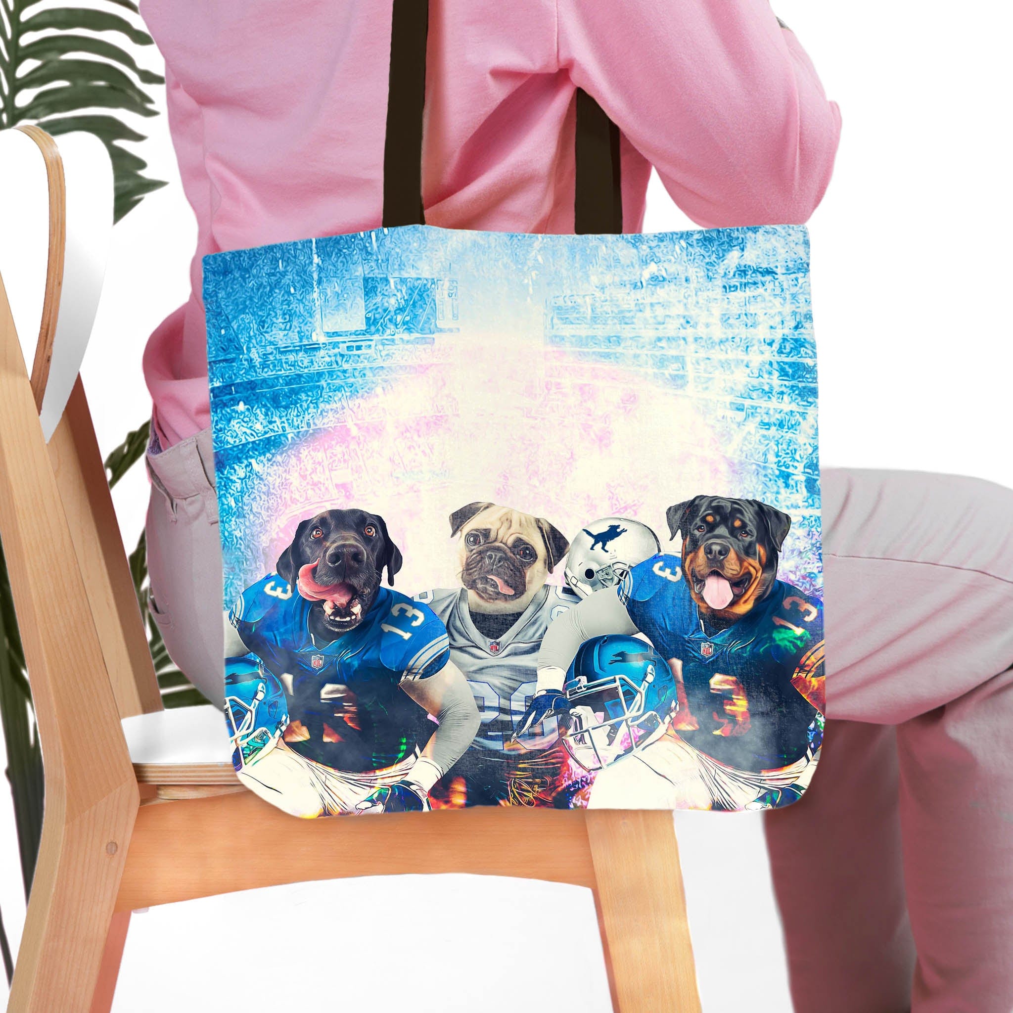 Personalized 3 pet tote bag with dog portraits in football uniforms on a blue background.