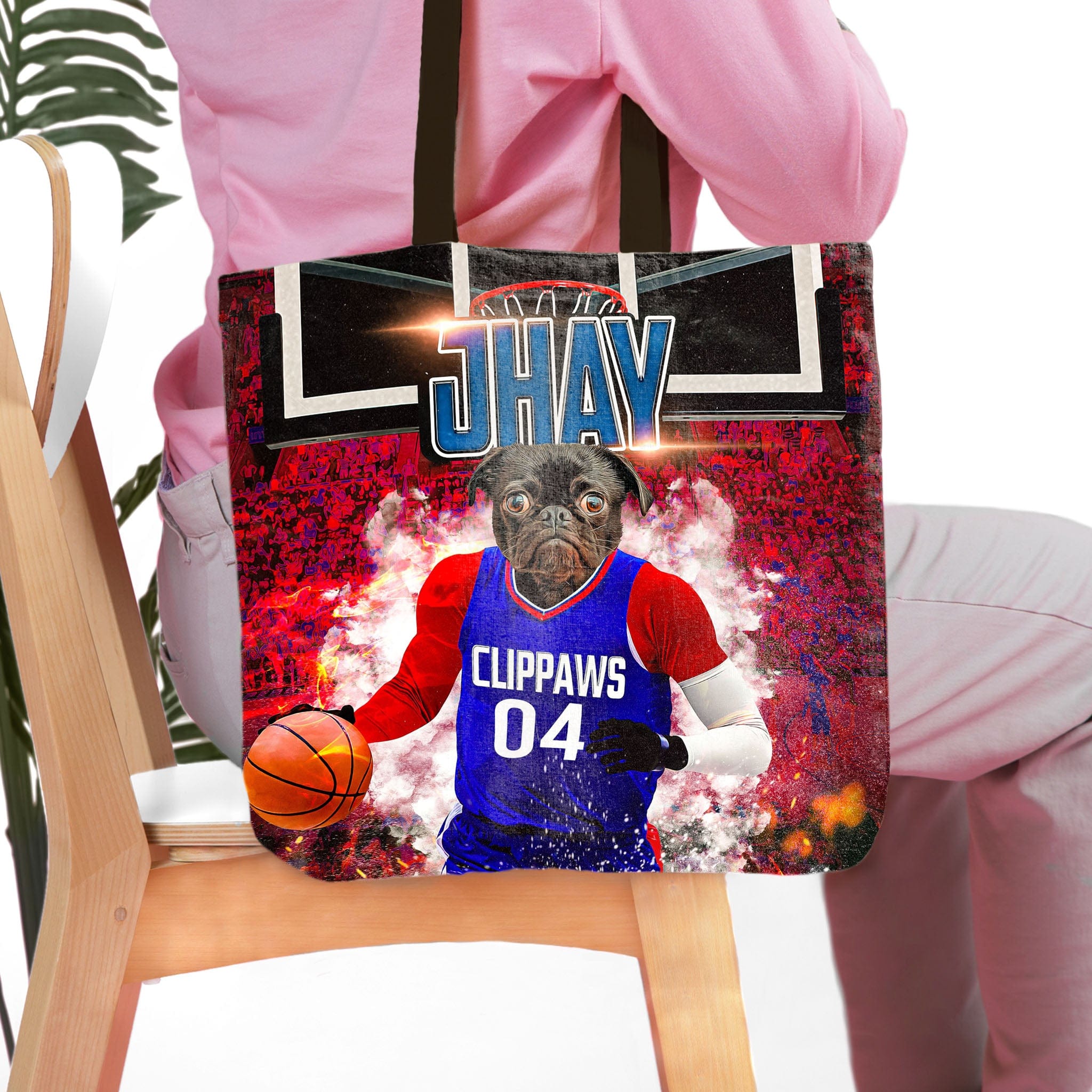 Personalized black tote bag with a pug pet portrait in a blue basketball jersey.