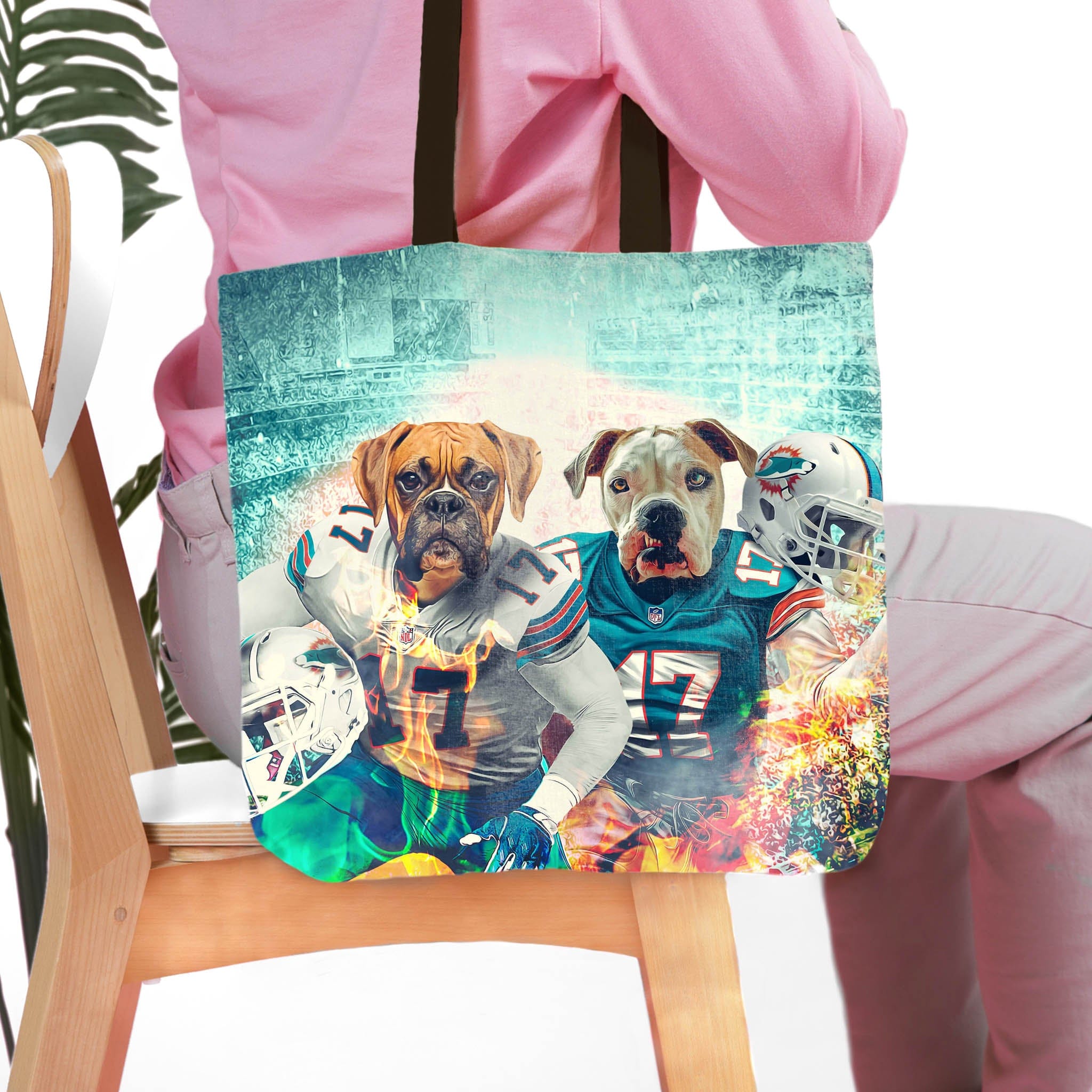 Personalized tote bag with two custom dog portraits in football uniforms.