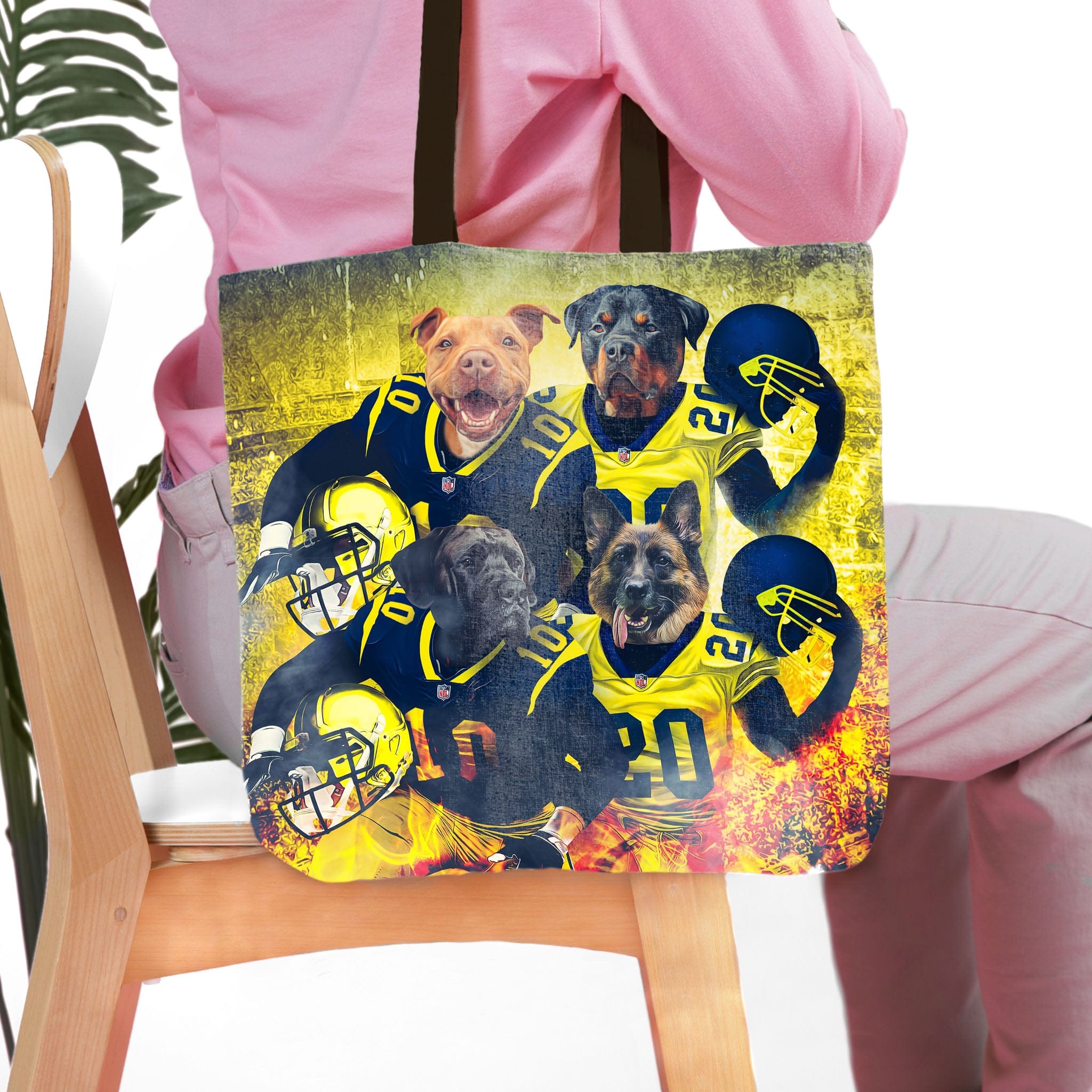 Personalized 'Michigan Doggos' 4 pet tote bag with custom dog portraits in football uniforms.