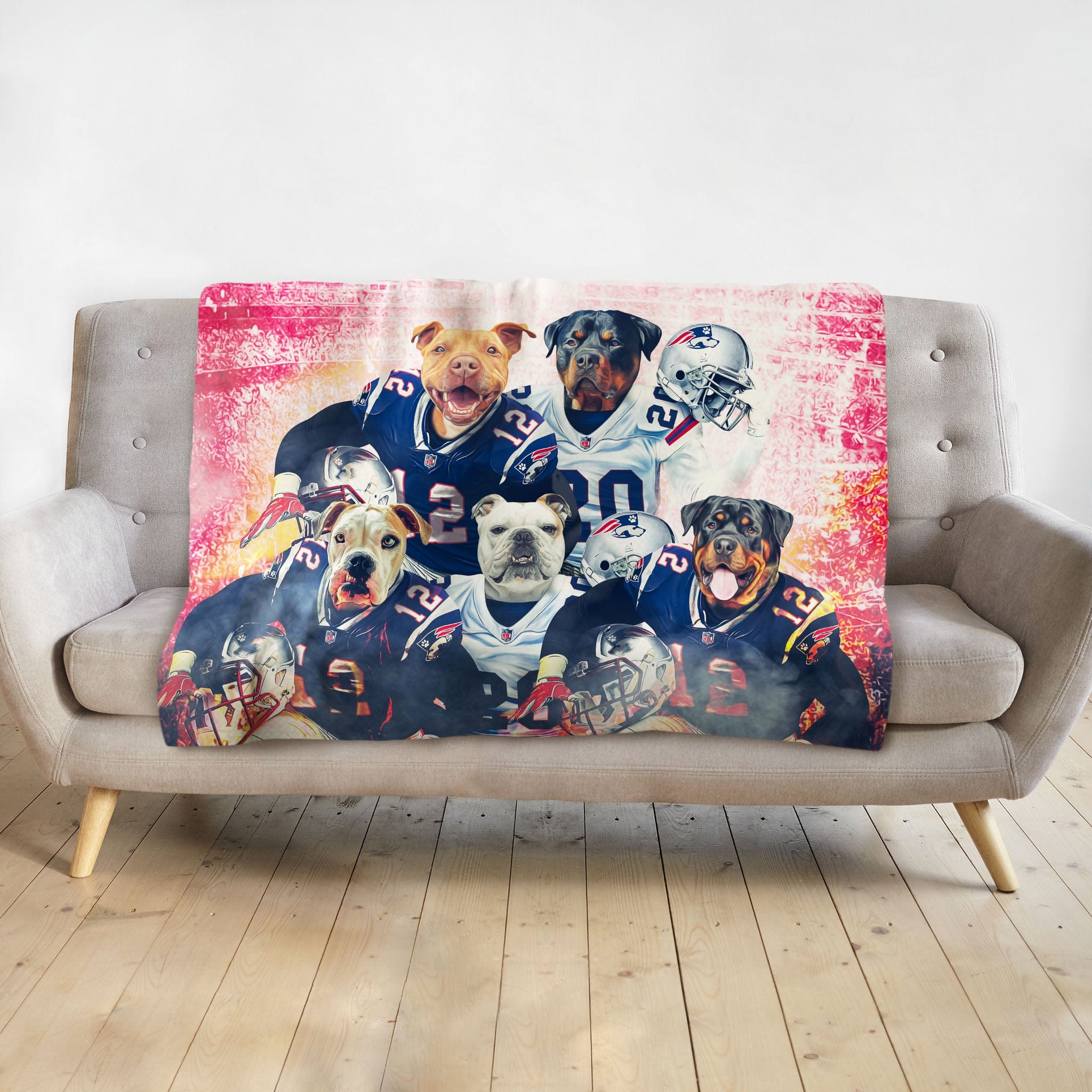 Personalized blanket with five dogs in New England Patriots football uniforms on a gray sofa.