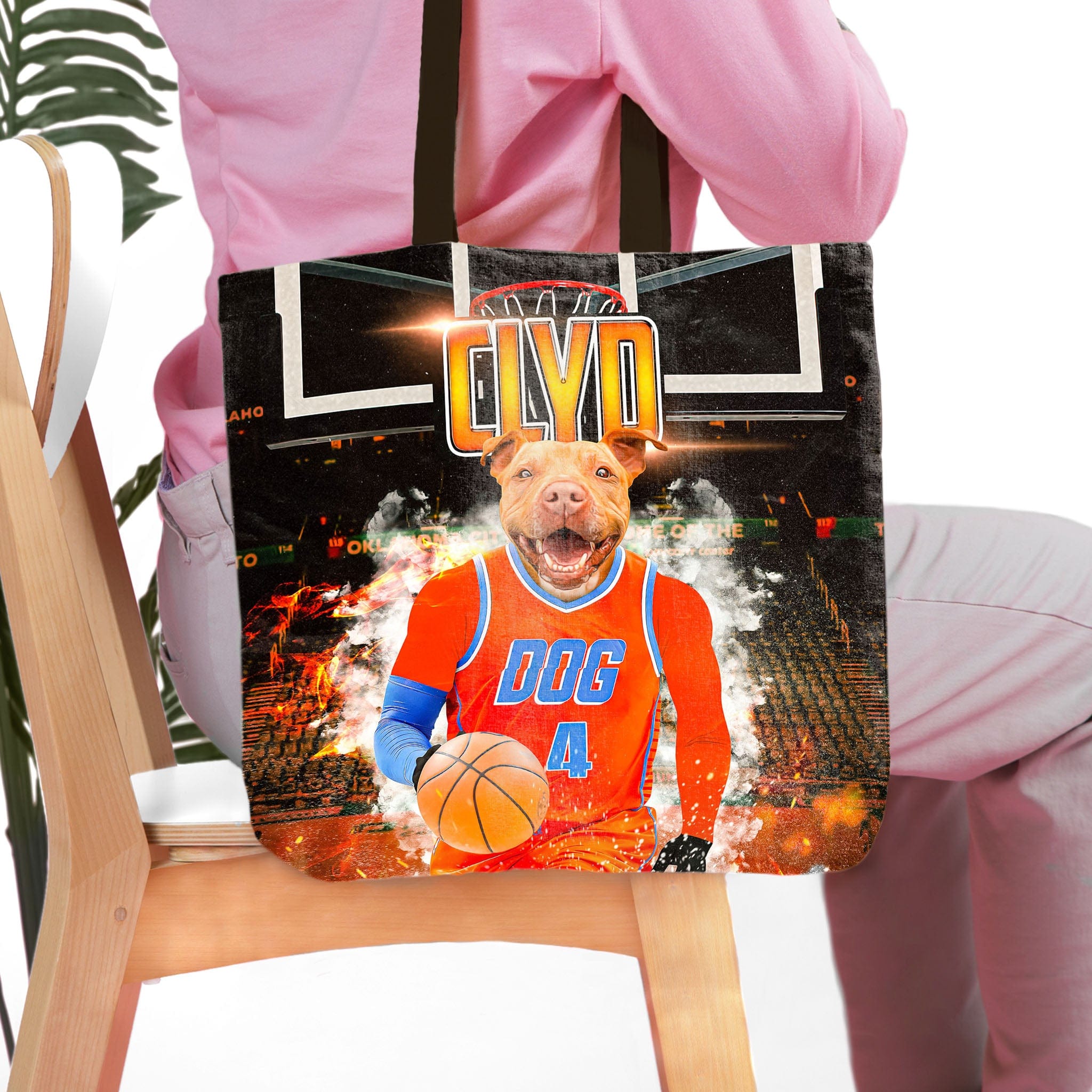 Personalized black tote bag with a custom dog portrait in an OKC Thunders basketball uniform.