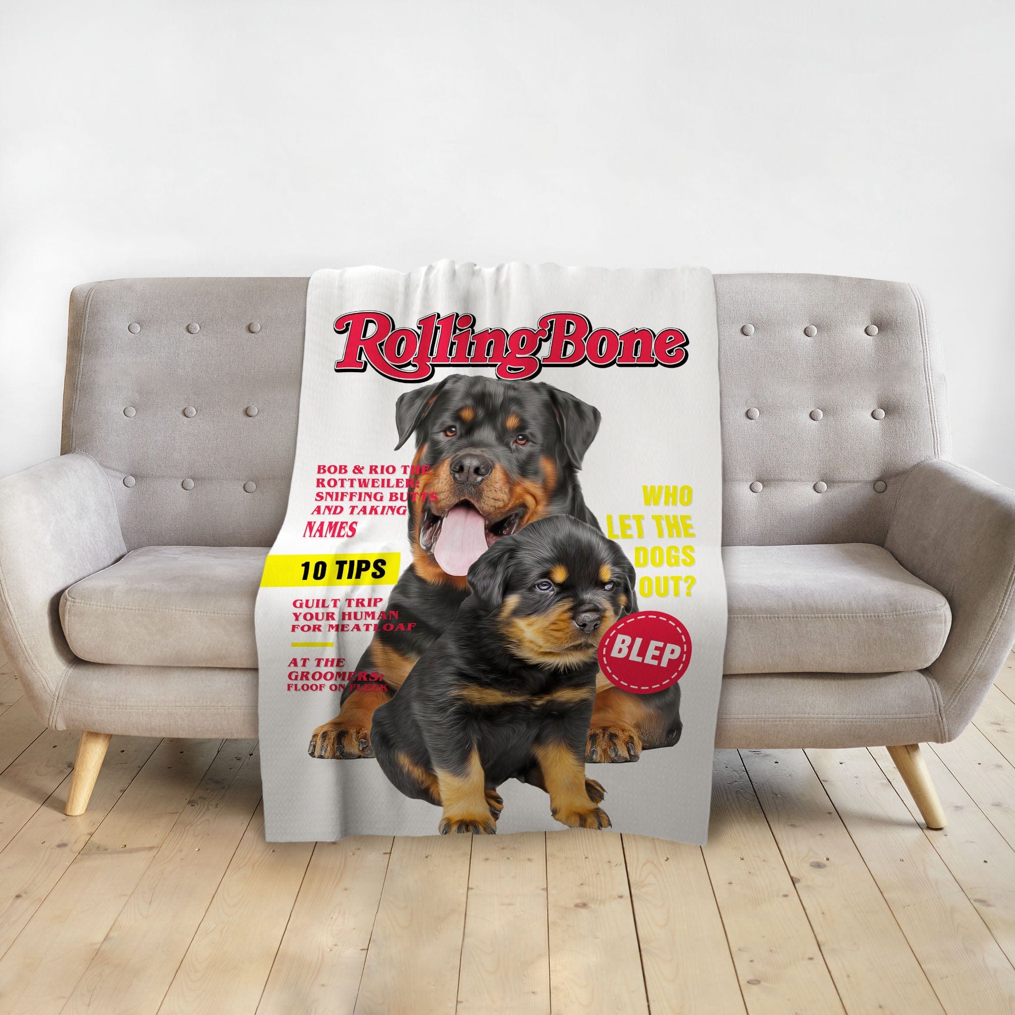 Personalized 'Rollingbone' blanket featuring custom Doggovinci portraits of two Rottweiler dogs.