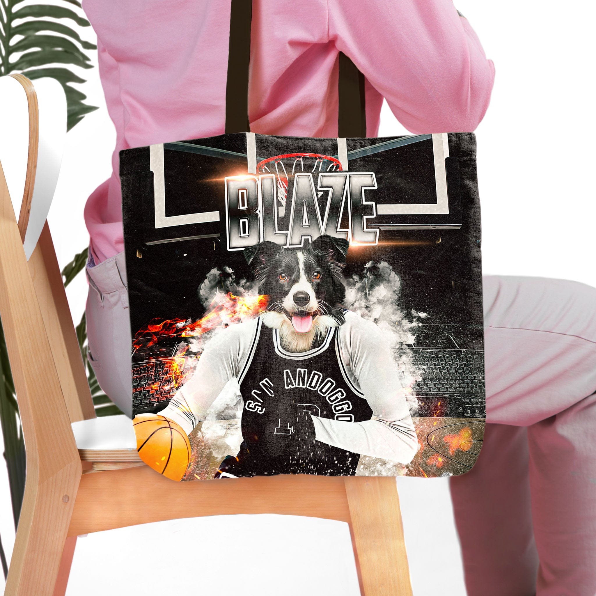 Personalized black tote bag with a custom dog portrait in a basketball uniform.