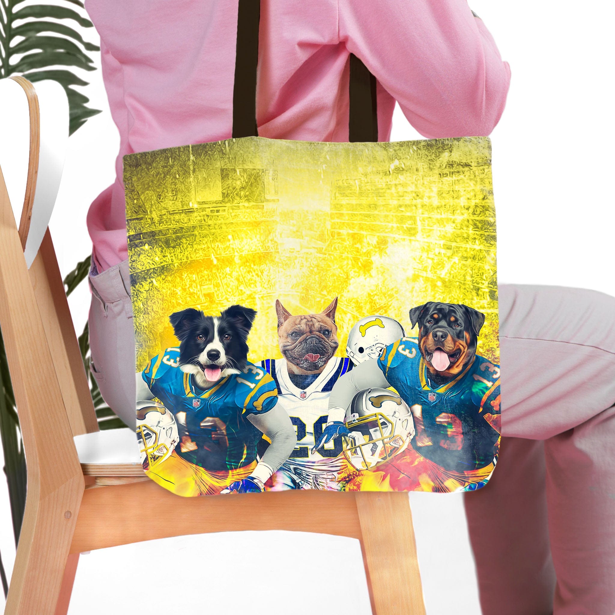 Personalized 3-pet tote bag with custom dog portraits in football uniforms on a yellow background.