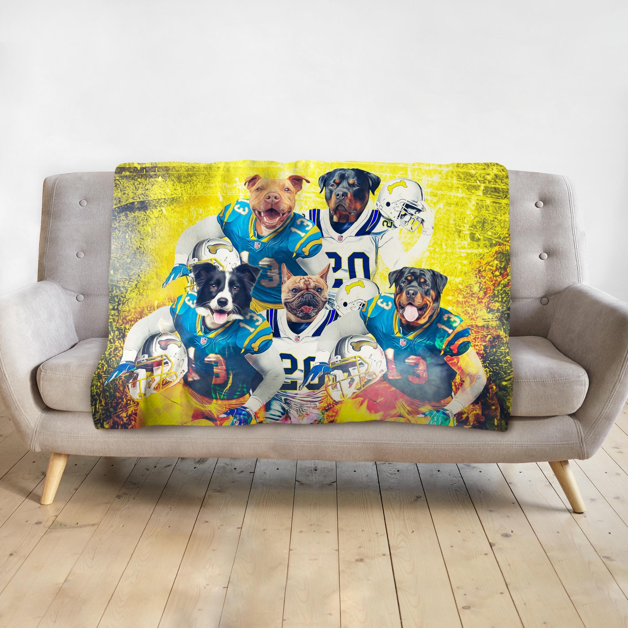 Personalized 5-pet football team portrait blanket in vibrant yellow and blue, draped on a sofa.