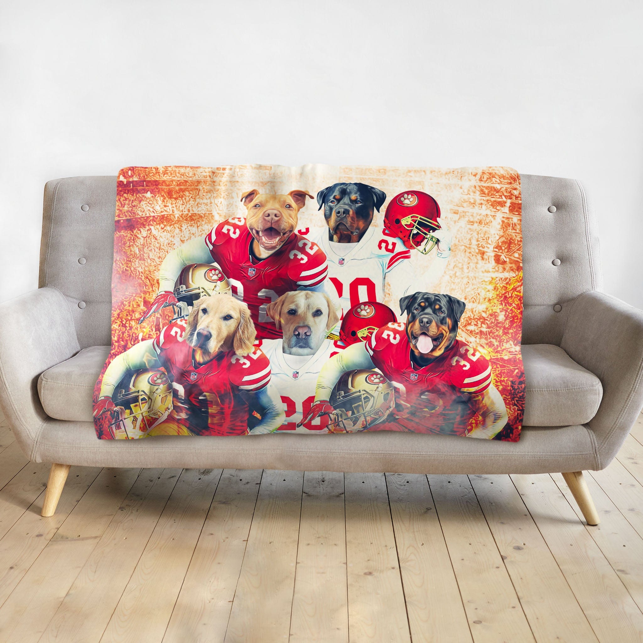 Personalized 5-pet blanket with dogs in San Francisco 49ers football uniforms, on a gray sofa.