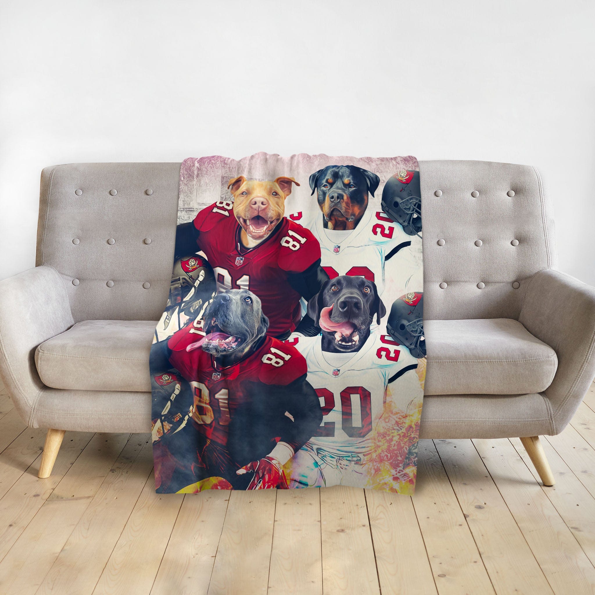 Personalized 4-pet blanket with dogs in football jerseys, draped on a gray sofa.