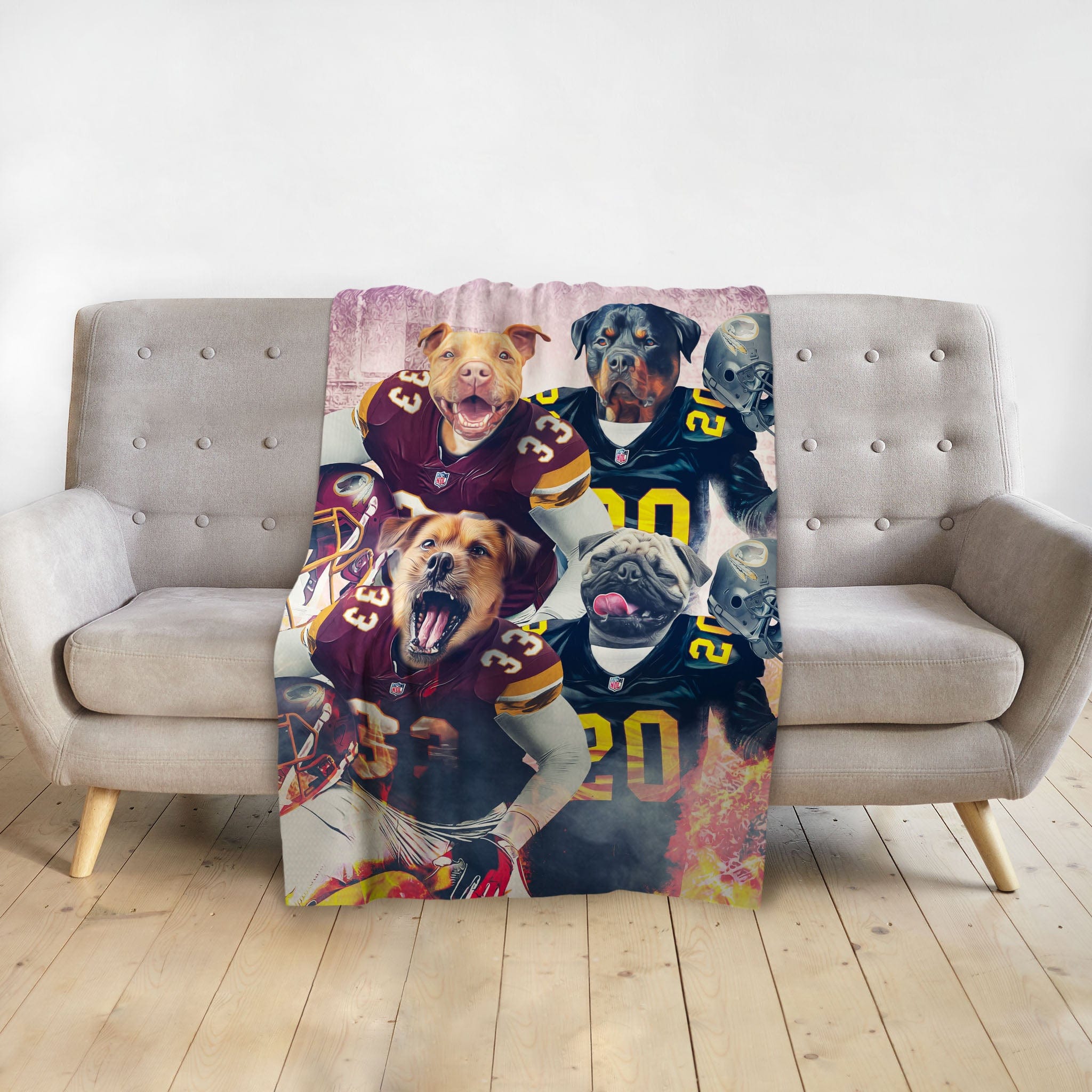 Personalized 4-pet blanket with dogs in football uniforms, draped over a gray sofa.