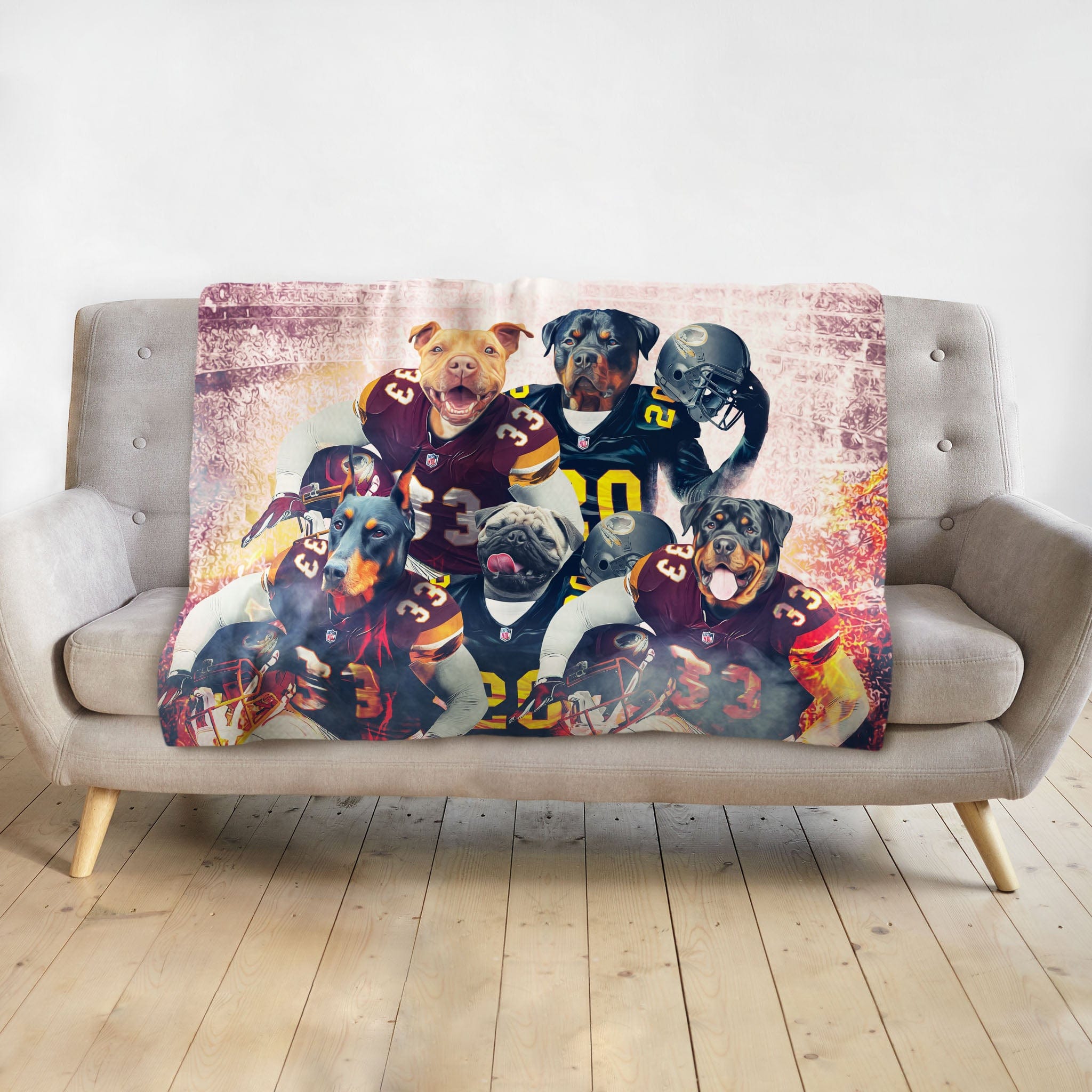 Personalized 5-pet blanket with dogs in football uniforms, draped on a grey couch.