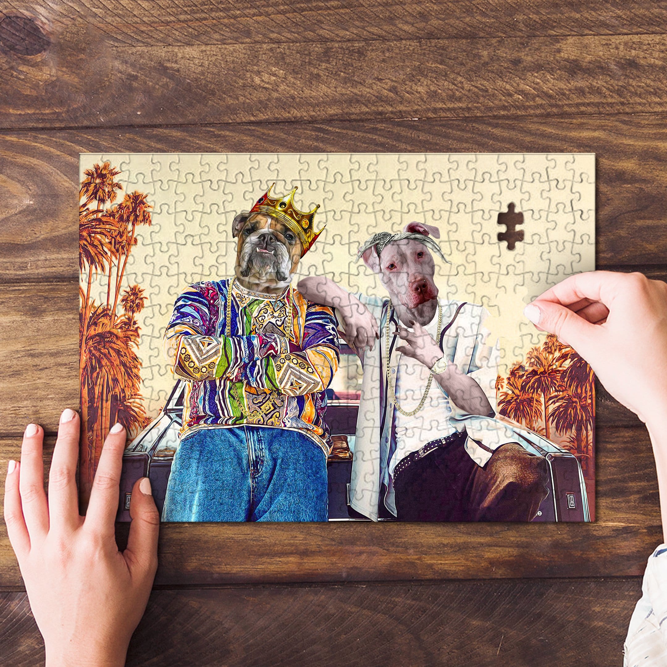 Personalized 2-pet puzzle with dogs in California-themed hip-hop attire, one piece being placed.