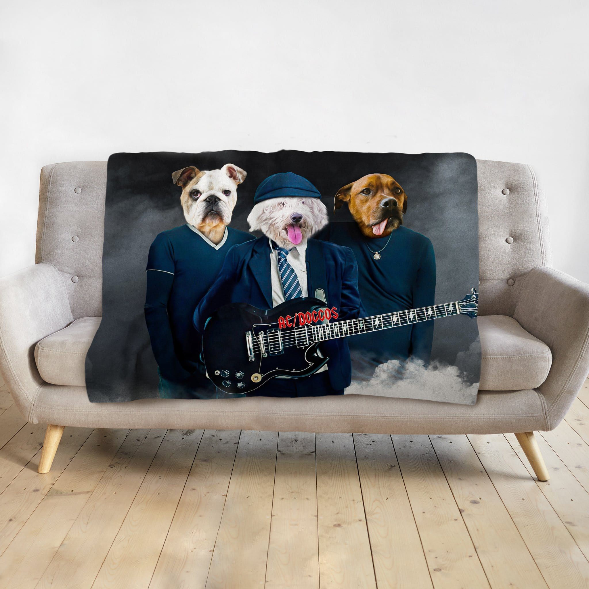 Personalized AC/Doggos 3 pet blanket with renaissance-style dog portraits on a gray couch.