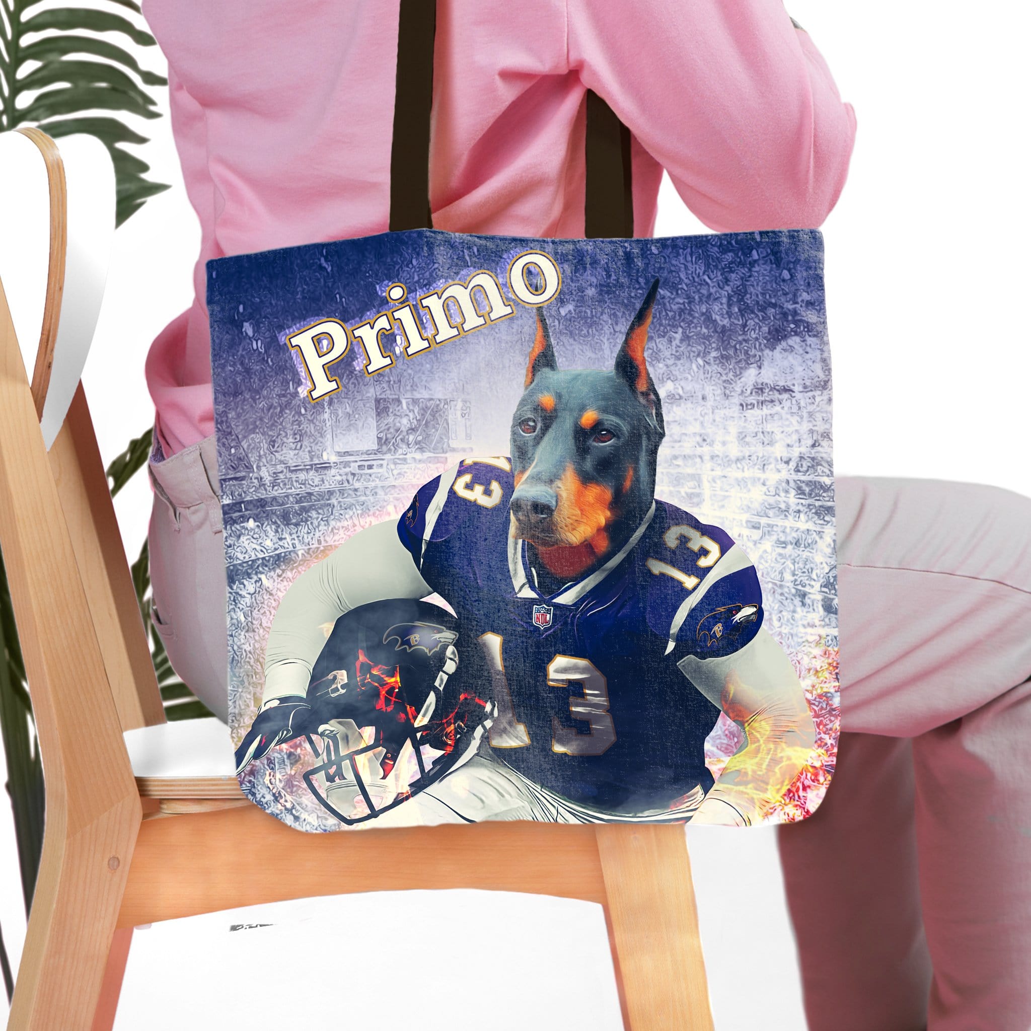 Personalized tote bag with a Doberman pet portrait in a football uniform.