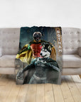 Personalized pet blanket with a pug as Robin and a husky as Batman in a Gotham city scene.