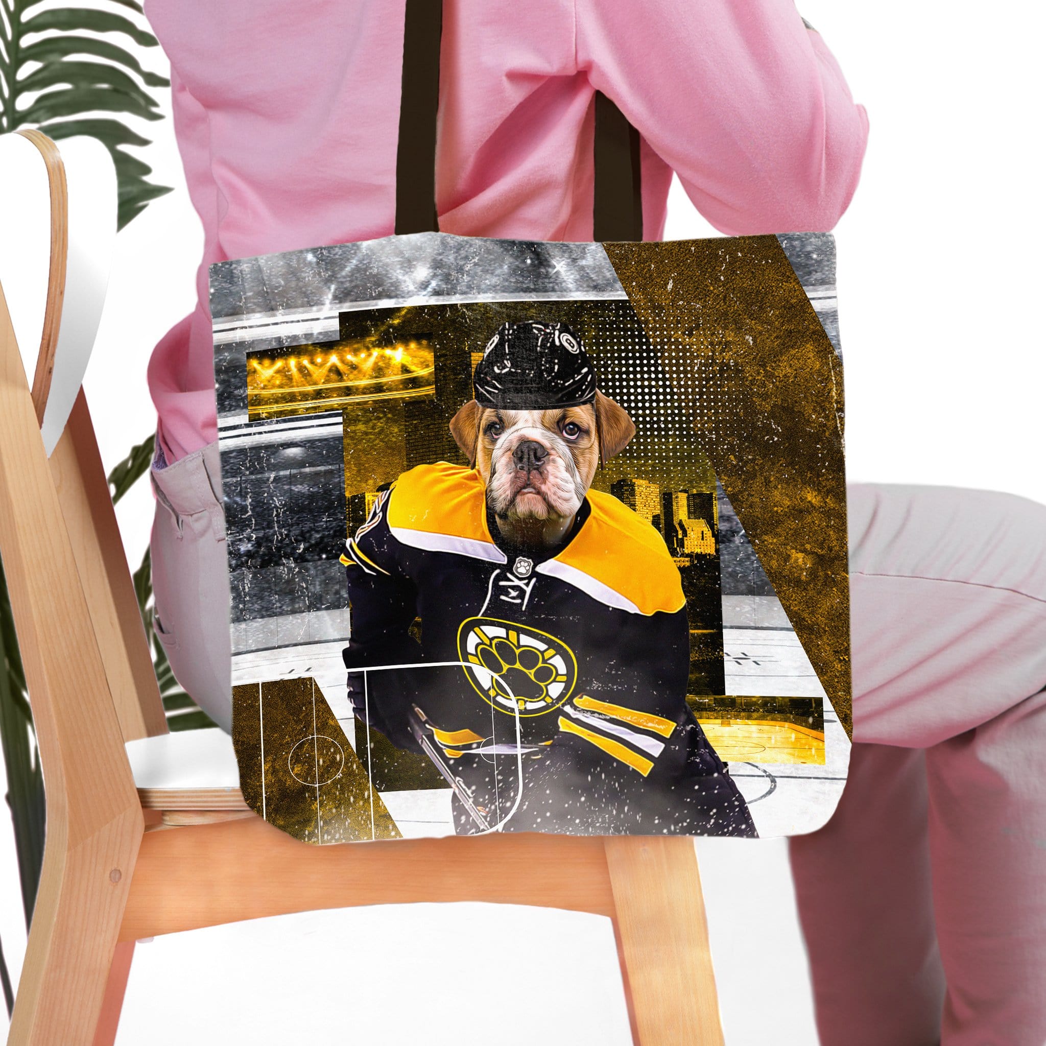 Personalized tote bag with a custom pet portrait of a bulldog in a black and yellow hockey uniform.