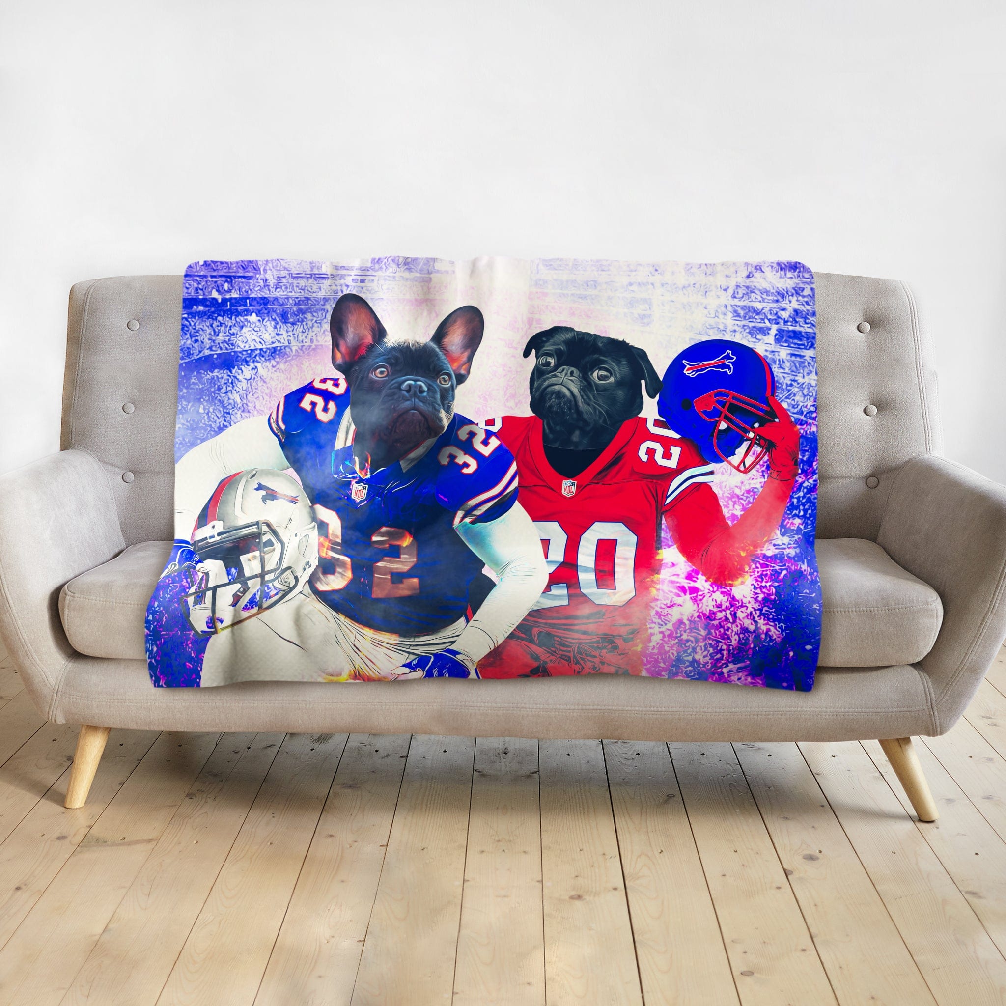 Personalized pet blanket with two dogs in Buffalo football uniforms, blue and red, on a grey couch.