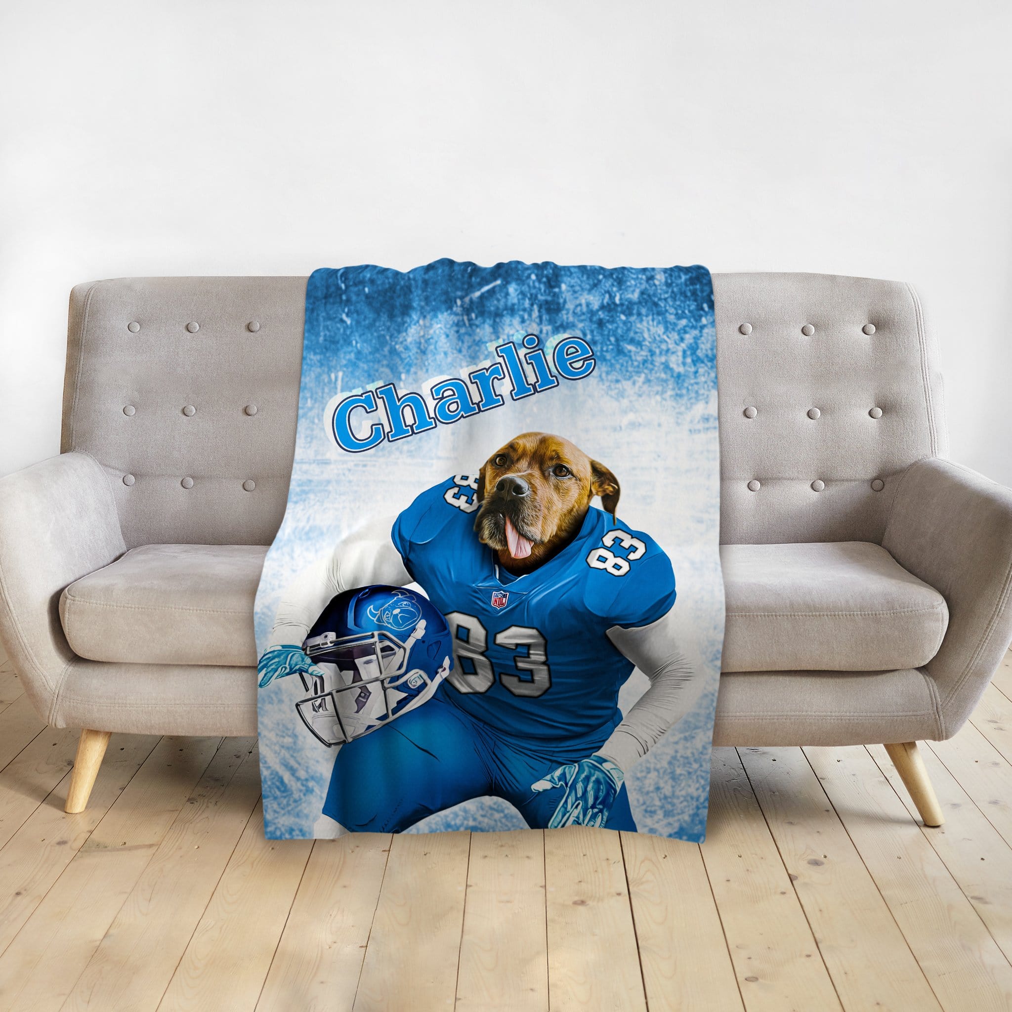 Personalized pet blanket with a dog's portrait in a blue football uniform, named "Charlie".