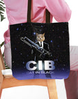 Personalized black tote bag with a custom cat portrait in a suit holding a futuristic gun, "CIB Cat in Black" text.