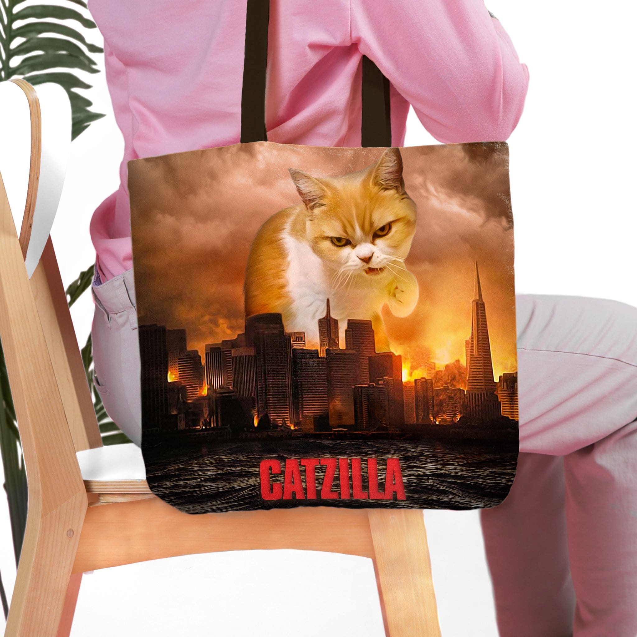 Personalized 'Catzilla' tote bag featuring a custom cat portrait in a city destruction scene.