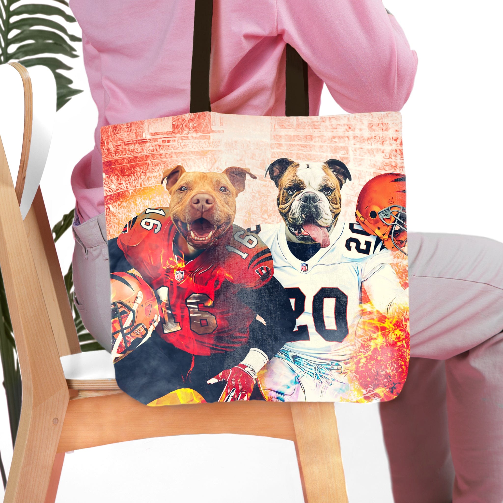 Personalized tote bag with two pet dog portraits in football uniforms, a pit bull and a bulldog.