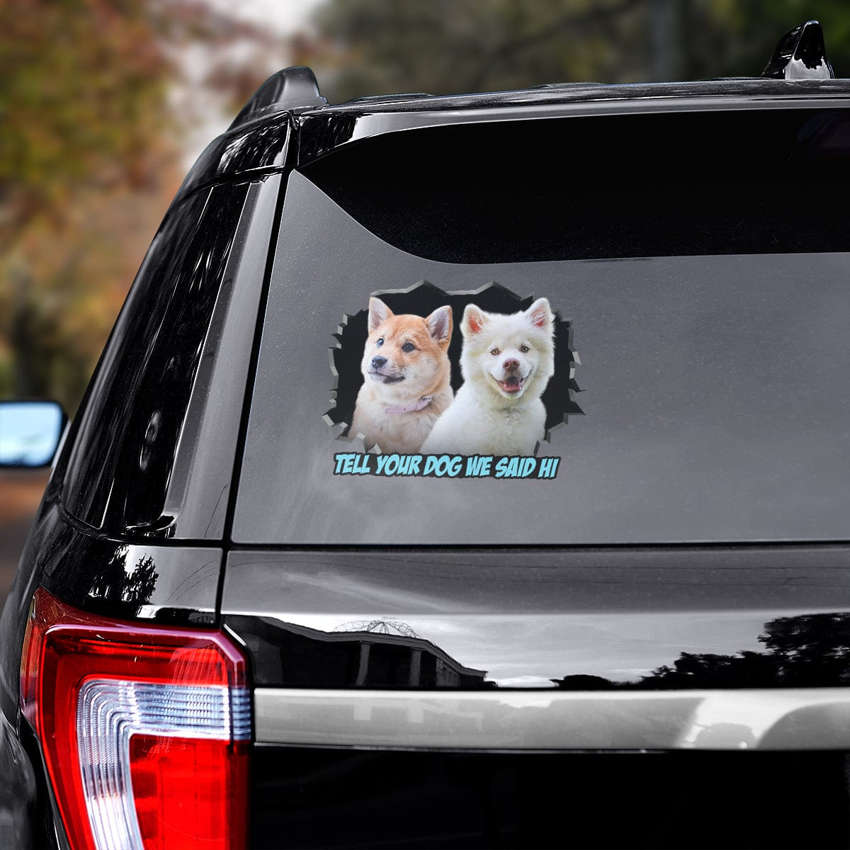Custom 2 pet dog decal on a car window, featuring a Shiba Inu and a white fluffy dog with "Tell your dog we said hi".